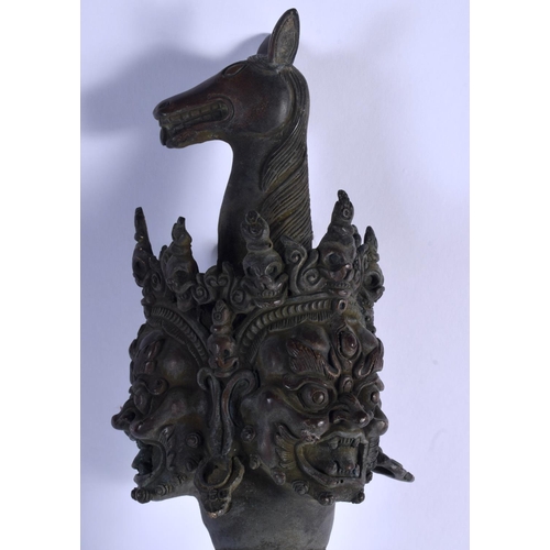 1570 - A LARGE CHINESE TIBETAN BRONZE PHURBA modelled with buddhistic mask heads. 60 cm long.