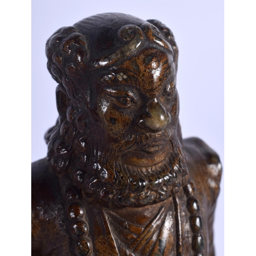 1574 - A RARE 18TH/19TH CENTURY CHINESE LACQUERED BRONZE JADE FIGURE OF A SCHOLAR Qing, modelled roaming ho... 