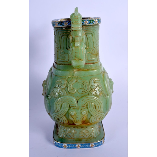 1575 - A CHINESE TWIN HANDLED JADE VASE 20th Century, with Continental silver mounts, decorated with foliag... 