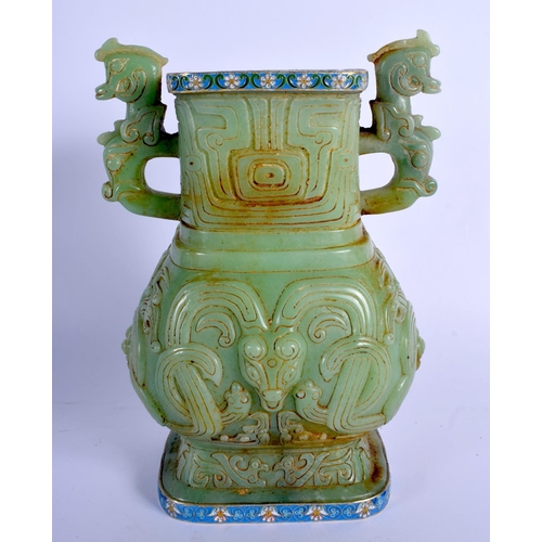 1575 - A CHINESE TWIN HANDLED JADE VASE 20th Century, with Continental silver mounts, decorated with foliag... 