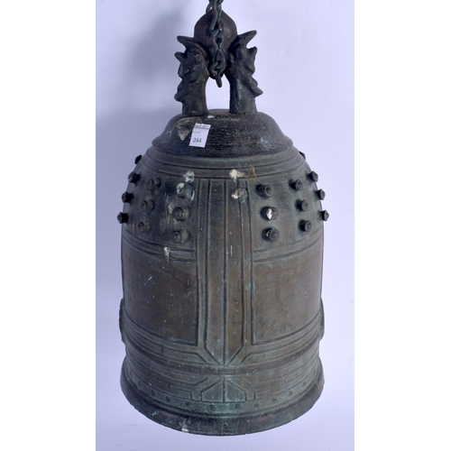 1580 - AN 18TH CENTURY JAPANESE EDO PERIOD BRONZE BELL with dimpled decoration. 33 cm x 16 cm.