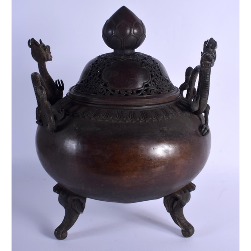 1582 - A LARGE CHINESE TWIN HANDLED BRONZE CENSER AND COVER 20th Century, decorated with foliage and vines.... 