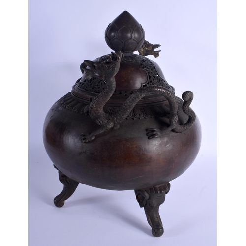 1582 - A LARGE CHINESE TWIN HANDLED BRONZE CENSER AND COVER 20th Century, decorated with foliage and vines.... 