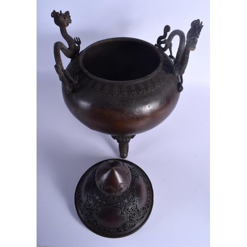 1582 - A LARGE CHINESE TWIN HANDLED BRONZE CENSER AND COVER 20th Century, decorated with foliage and vines.... 