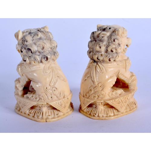 1588 - A PAIR OF EARLY 20TH CENTURY CHINESE CARVED IVORY BUDDHISTIC LIONS Qing. 6 cm x 4 cm.