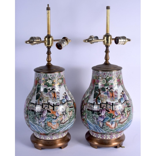 1602 - A PAIR OF 1950S CHINESE PORCELAIN FAMILLE ROSE HU VASES converted to lamps. Porcelain 27 cm x 16 cm.