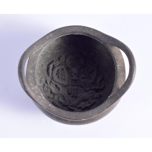 1625 - AN 18TH/19TH CENTURY CHINESE TWIN HANDLED BRONZE CENSER bearing Xuande marks to base, with internal ... 