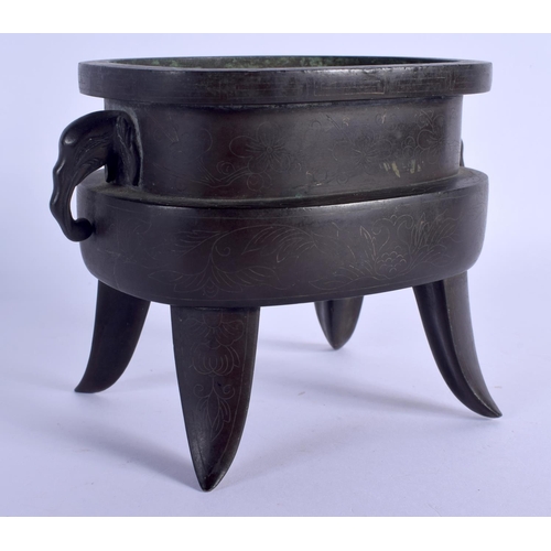 1626 - AN 18TH/19TH CENTURY CHINESE TWIN HANDLED BRONZE CENSER with elephants handles, inlaid with fine sil... 