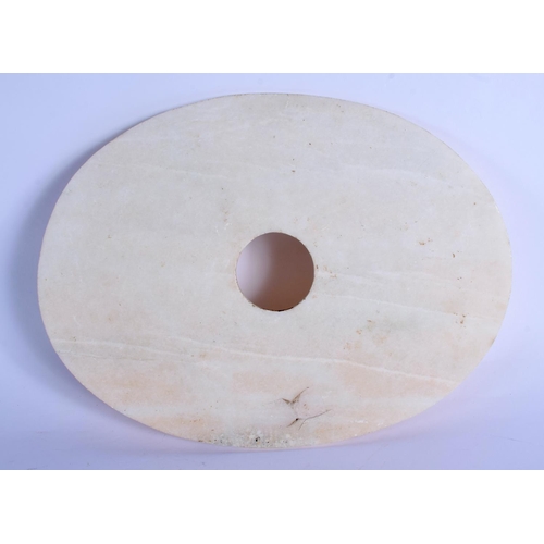 1639 - A CHINESE CARVED STONE BI DISC 20th Century, decorated with chilong. 32 cm x 22 cm.