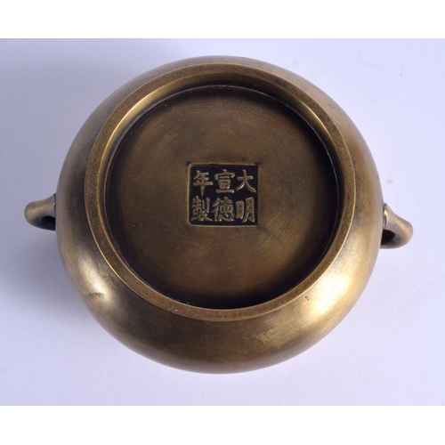 1643 - AN 18TH CENTURY CHINESE TWIN HANDLED BRONZE CENSER Qing, bearing Xuande marks to base. 988 grams. 16... 