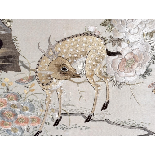 1644 - A 19TH CENTURY CHINESE SILKWORK EMBROIDERED PANEL Qing, depicting two deer roaming within a landscap... 