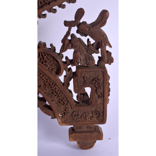 1651 - A 19TH CENTURY CHINESE CARVED CANTON SANDALWOOD SWINGING FRAME Qing, decorated with figures and foli... 