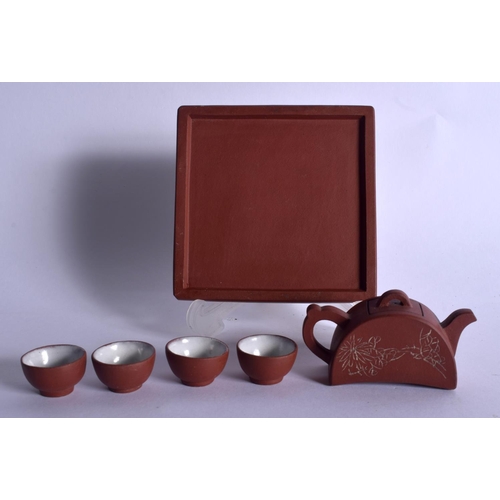 1657 - A VERY RARE EARLY 20TH CENTURY CHINESE MINIATURE YIXING TEASET upon a tray. Tray 9.25 cm square. (6)