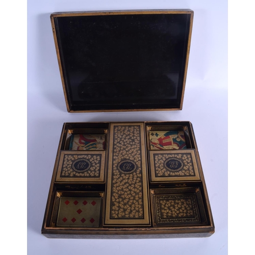 1660 - A LARGE EARLY 19TH CENTURY CHINESE EXPORT BLACK LACQUER GAMING BOX AND COVER containing numerous mot... 