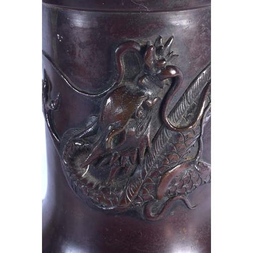 1667 - A LARGE 19TH CENTURY JAPANESE MEIJI PERIOD BRONZE VASE decorated with a dragon. 46 cm x 18 cm.