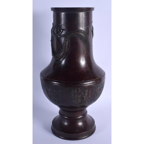 1667 - A LARGE 19TH CENTURY JAPANESE MEIJI PERIOD BRONZE VASE decorated with a dragon. 46 cm x 18 cm.