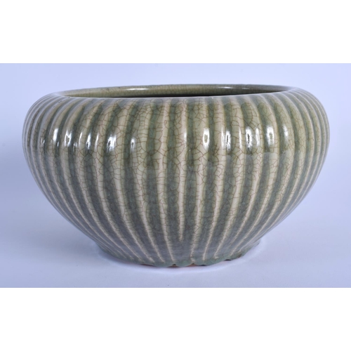 1668 - A 19TH CENTURY CHINESE RIBBED CELADON STONEWARE CENSER Qing. 21 cm x 13 cm.