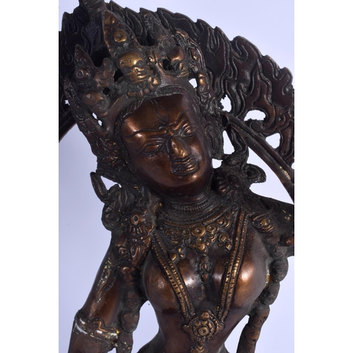 1680 - A LARGE EARLY 20TH CENTURY INDO TIBETAN NEPALESE BRONZE BUDDHA modelled in front of a flaming surrou... 