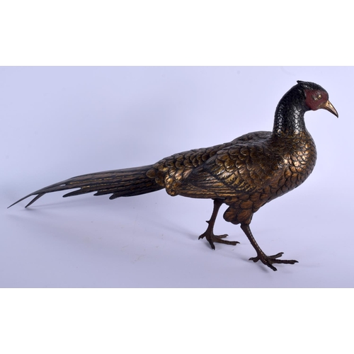 1687 - A 19TH CENTURY JAPANESE PATINATED BRONZE FIGURE OF A ROAMING PHEASANT of naturalistic form, modelled... 