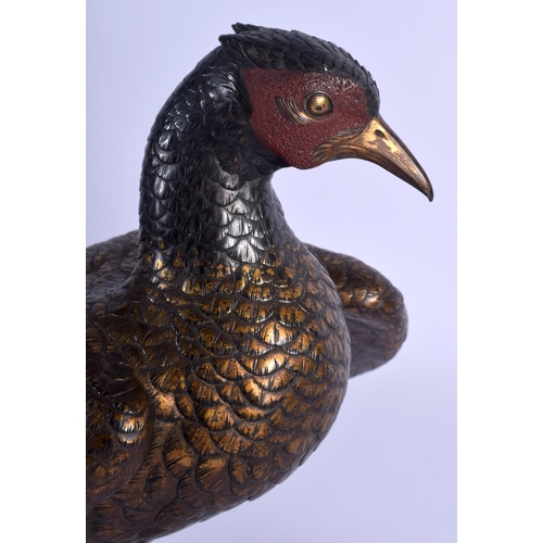 1687 - A 19TH CENTURY JAPANESE PATINATED BRONZE FIGURE OF A ROAMING PHEASANT of naturalistic form, modelled... 