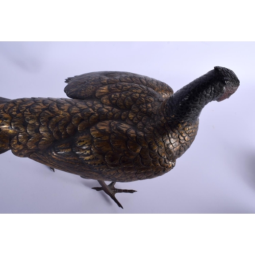 1687 - A 19TH CENTURY JAPANESE PATINATED BRONZE FIGURE OF A ROAMING PHEASANT of naturalistic form, modelled... 