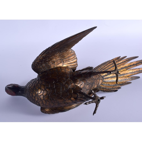 1687 - A 19TH CENTURY JAPANESE PATINATED BRONZE FIGURE OF A ROAMING PHEASANT of naturalistic form, modelled... 