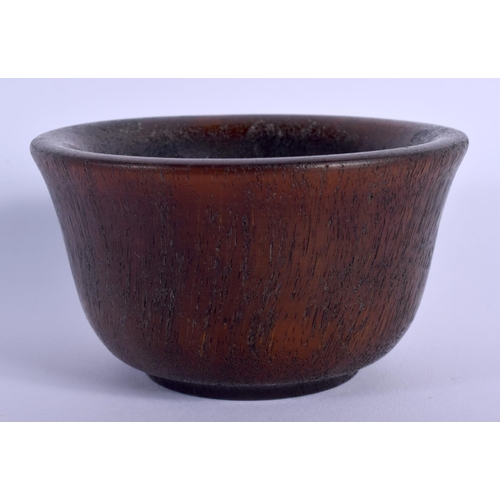 1693 - A CHINESE CARVED BUFFALO HORN TYPE CIRCULAR LIBATION CUP 20th Century. 212 grams. 8.5 cm diameter.