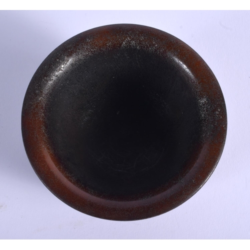 1693 - A CHINESE CARVED BUFFALO HORN TYPE CIRCULAR LIBATION CUP 20th Century. 212 grams. 8.5 cm diameter.