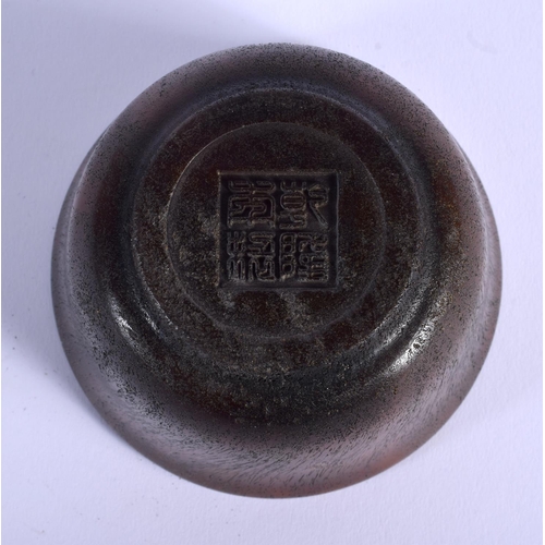 1693 - A CHINESE CARVED BUFFALO HORN TYPE CIRCULAR LIBATION CUP 20th Century. 212 grams. 8.5 cm diameter.