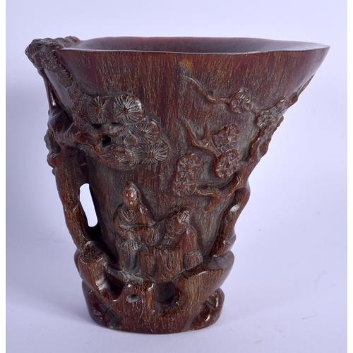 1703 - A CHINESE CARVED BUFFALO HORN TYPE LIBATION CUP 20th Century. Decorated with figures and landscapes.... 