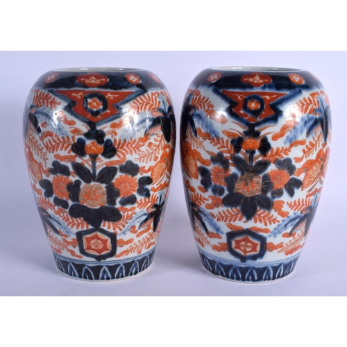 1711 - A PAIR OF 19TH CENTURY JAPANESE MEIJI PERIOD IMARI PORCELAIN VASES painted with foliage and insects.... 