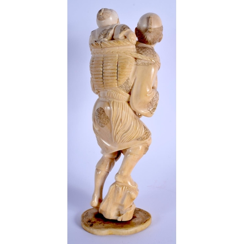 1719 - A 19TH CENTURY JAPANESE MEIJI PERIOD CARVED IVORY OKIMONO modelled as a male and child. 19 cm x 5 cm... 