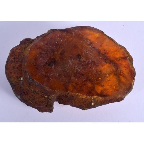 1723 - A RARE EARLY 20TH CENTURY CHINESE CARVED AMBER SCHOLARS BOULDER Late Qing. 497 grams. 14 cm x 10 cm.