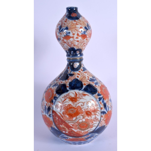 1727 - A 19TH CENTURY JAPANESE MEIJI PERIOD IMARI BULBOUS PORCELAIN VASE painted with foliage. 27 cm high.