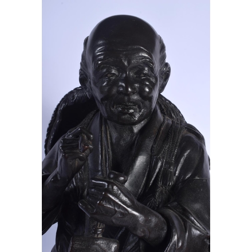 1735 - A LARGE 19TH CENTURY JAPANESE MEIJI PERIOD BRONZE OKIMONO modelled as a standing farmer holding a pi... 