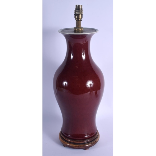 1739 - A 19TH CENTURY CHINESE FLAMBE SANG DU BOEUF VASE Qing, converted to a lamp. Porcelain 41 cm x 16 cm.