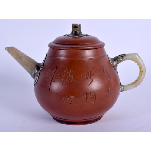 1741 - A CHINESE YIXING POTTERY TEAPOT AND COVER 20th Century, with jade handle. 14.5 cm wide.