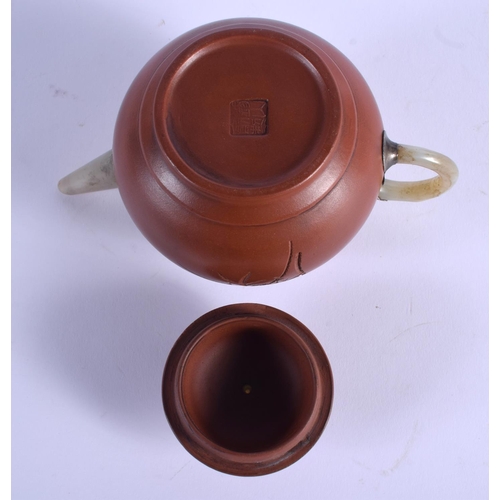 1741 - A CHINESE YIXING POTTERY TEAPOT AND COVER 20th Century, with jade handle. 14.5 cm wide.