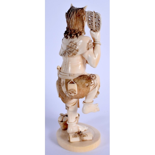 1742 - A FINE 19TH CENTURY JAPANESE MEIJI PERIOD CARVED IVORY OKIMONO modelled holding a pierced fan. 14.5 ... 