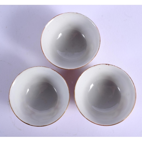 1749 - A SET OF THREE EARLY 20TH CENTURY CHINESE FAMILLE ROSE DRAGON TEABOWLS Guangxu mark and period, pain... 