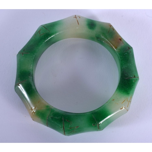 1754 - A CHINESE JADE BANGLE 20th Century. 8.5 cm wide.