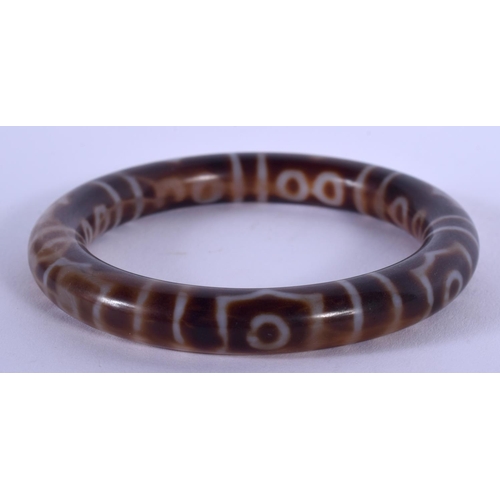 1763 - A CHINESE TIBETAN AGATE BANGLE. 6.5 cm wide.