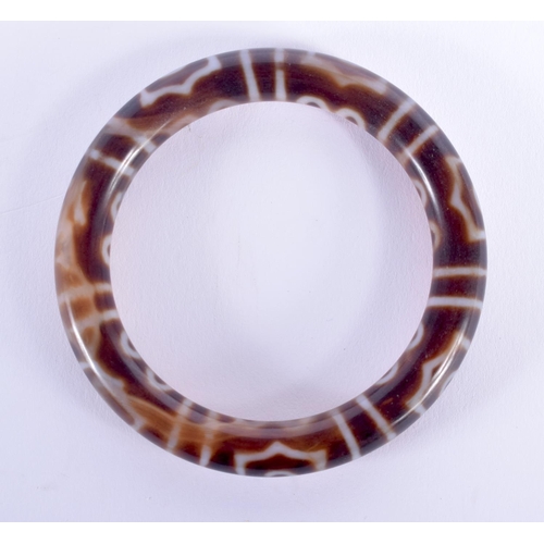 1763 - A CHINESE TIBETAN AGATE BANGLE. 6.5 cm wide.