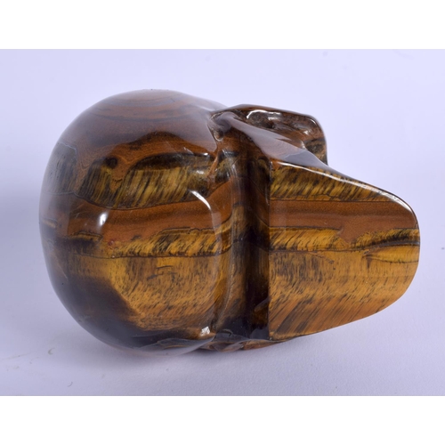 1776 - A CHINESE CARVED TIGERS EYE MODEL OF A SKULL 20th Century. 8.5 cm x 7 cm.