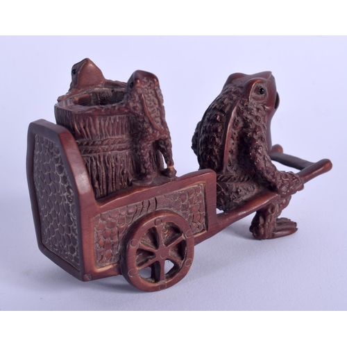 1779 - A JAPANESE CARVED WOOD FIGURE OF A TOAD modelled pulling a cart. 8 cm x 4.5 cm.