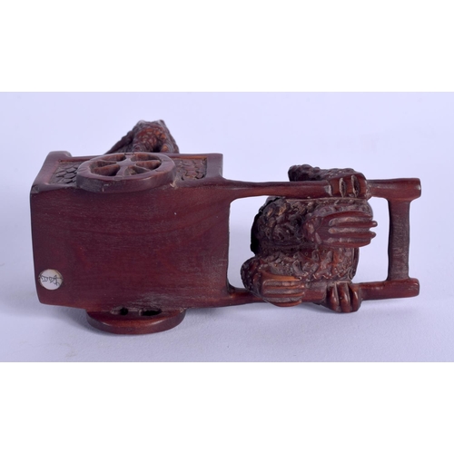 1779 - A JAPANESE CARVED WOOD FIGURE OF A TOAD modelled pulling a cart. 8 cm x 4.5 cm.