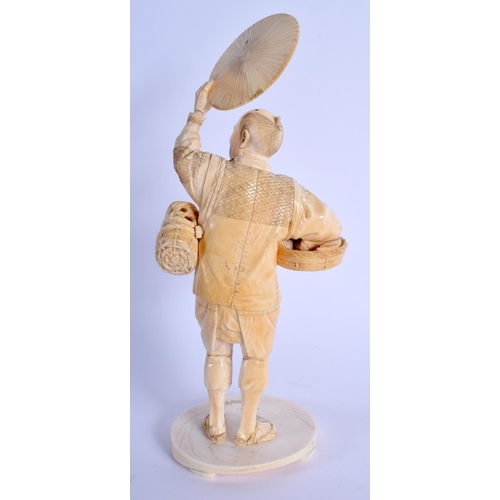 1781 - A 19TH CENTURY JAPANESE MEIJI PERIOD CARVED IVORY OKIMONO modelled as a bird catcher holding aloft h... 