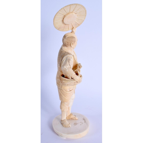 1781 - A 19TH CENTURY JAPANESE MEIJI PERIOD CARVED IVORY OKIMONO modelled as a bird catcher holding aloft h... 