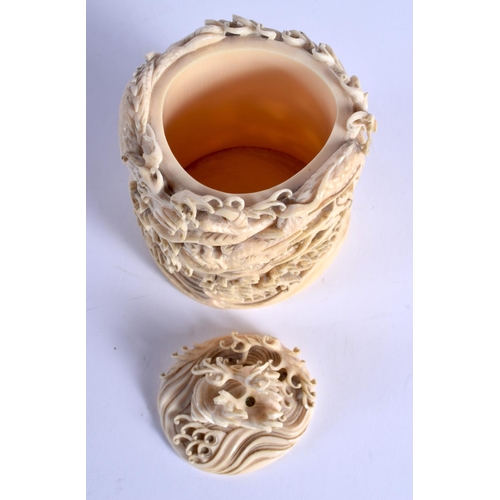 1792 - A 19TH CENTURY JAPANESE MEIJI PERIOD CARVED IVORY DRAGON VASE AND COVER modelled amongst crashing wa... 