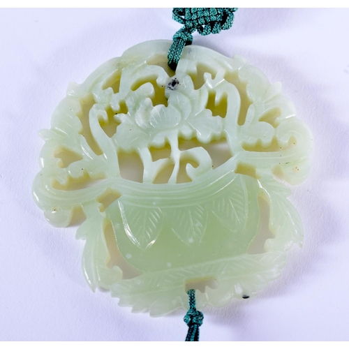 1812 - AN EARLY 20TH CENTURY CHINESE CELADON JADE PENDANT Late Qing. 4 cm x 5.5 cm.